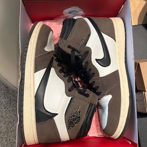 Travis Scot Jordan 1. Cream bottom, brown suede, Travis Scot logo back of shoe.